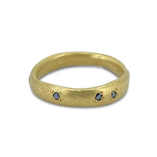 gold organic form ring with black diamonds