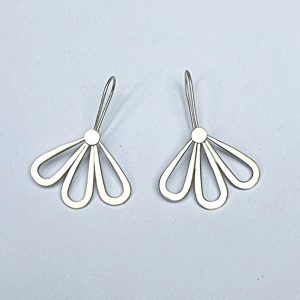 silver floral drop earrings on white background