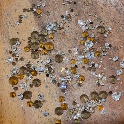 dismantled costume jewellery on a bench